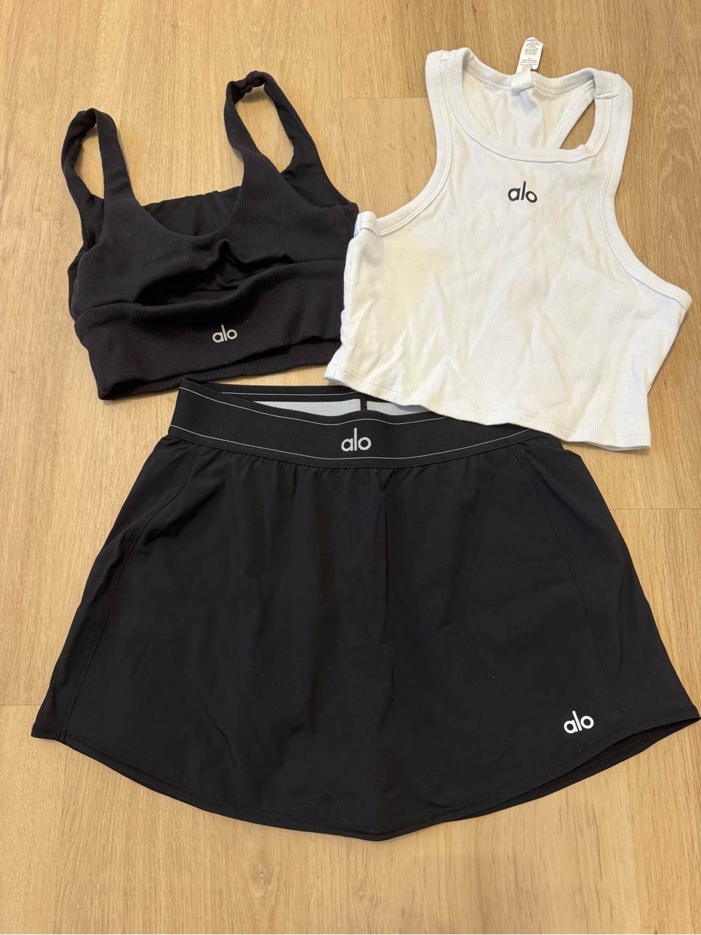 ALO Yoga Black Skort with Black Sports Bra and White Tank Crop